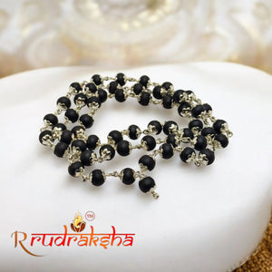 Karungali beaded necklace on a white stone with 'R Rudraksha' branding. lab Certified German Silver Mala 54 Beads