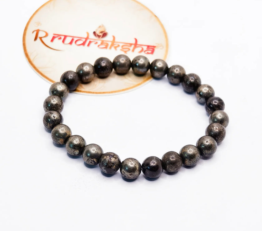 Pyrite bracelet on a white background with 'Rudraksha' branding.