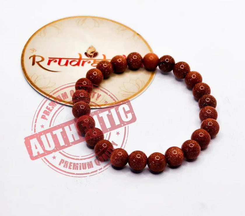 Bracelet made of Sun Stone beads on a white background with 'R Rudraksha' branding.