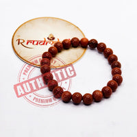 Bracelet made of Sun Stone beads on a white background with 'R Rudraksha' branding.