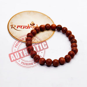 Bracelet made of Sun Stone beads on a white background with 'R Rudraksha' branding.