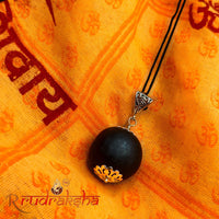 Karungali pendant necklace on a yellow fabric background with ' R Rudraksha' branding. Lab Tested Authentic product 