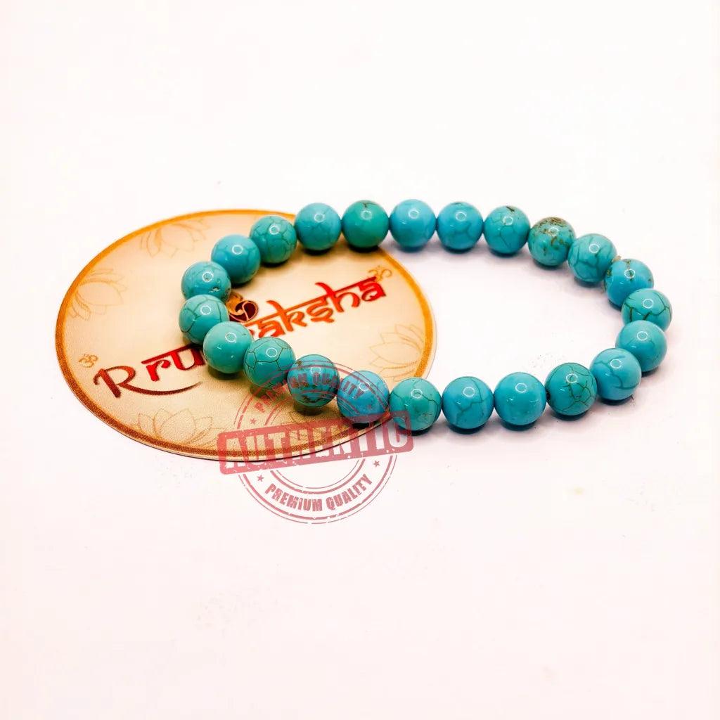Turquoise beaded bracelet Lab Certified on a white background with a R Rudraksha brand logo.