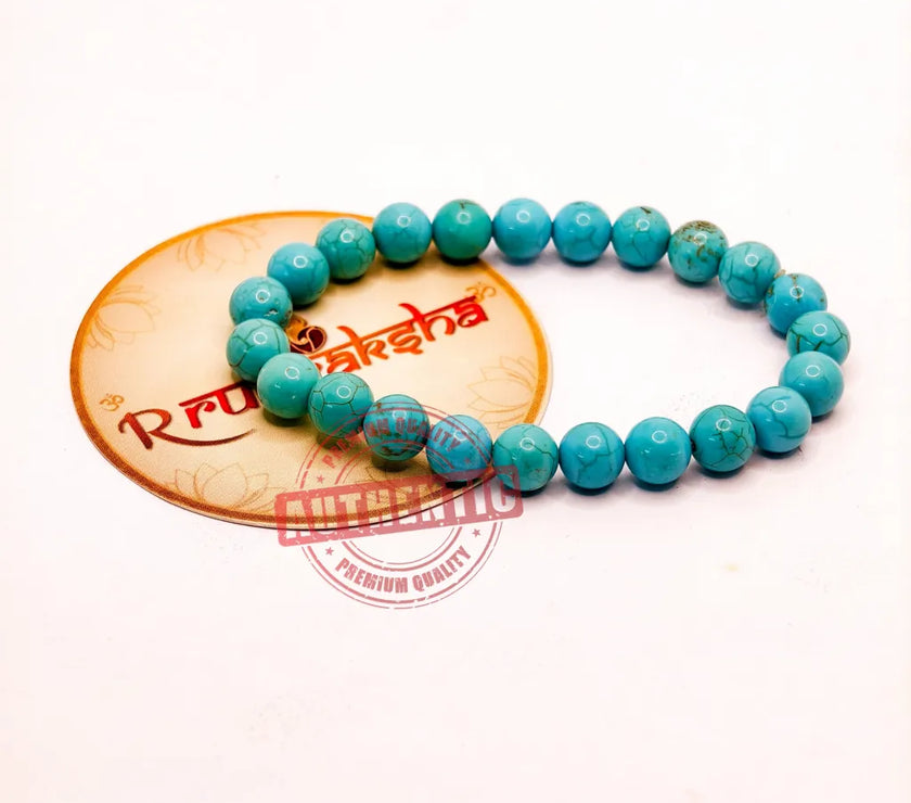 Turquoise beaded bracelet Lab Certified on a white background with a R Rudraksha brand logo.