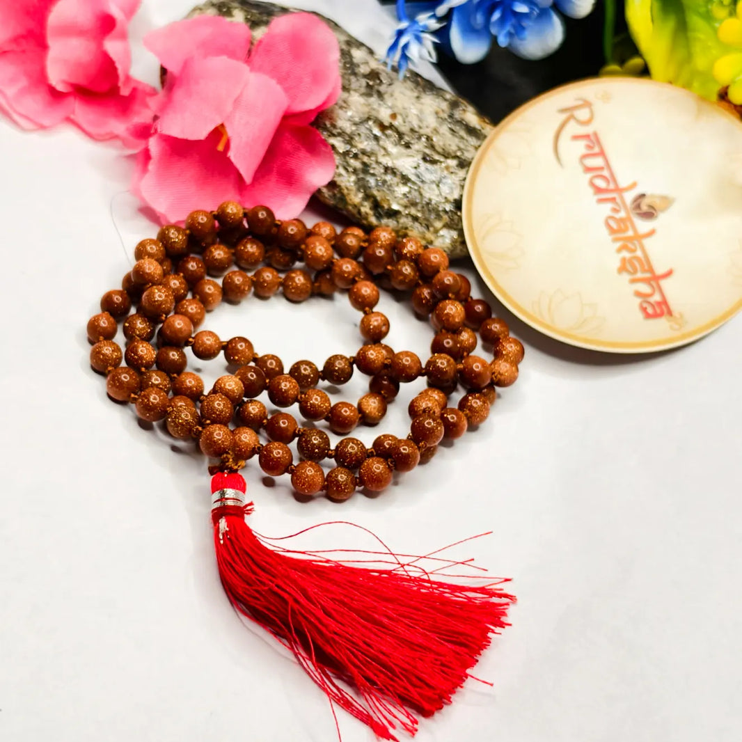 Sun stone gemstone beaded necklace with red tassel on a white background. Lab Tested Authentic product 