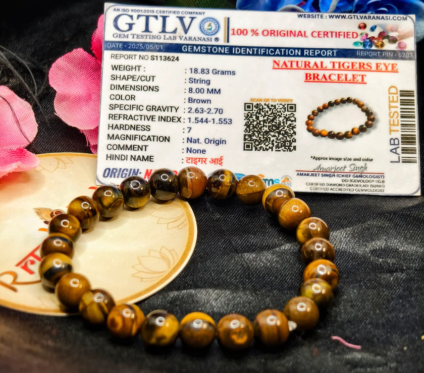 Lab Tested Tiger eye bracelet with a GTLV certification card on a textured surface.